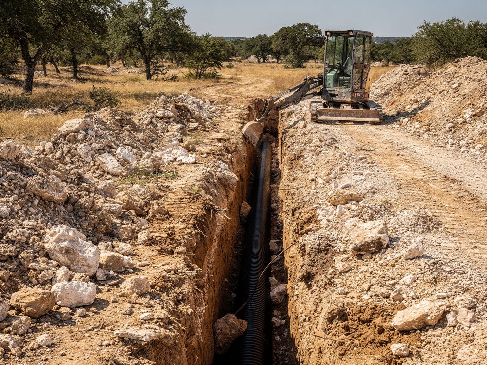 Trench dug for utilities on a Central Texas job site